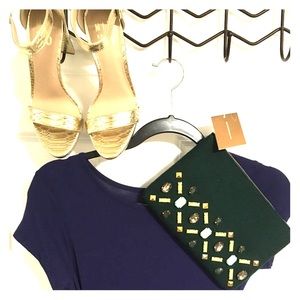 Francesca’s green wool clutch with gems